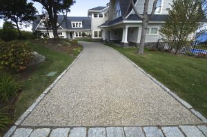 Exposed aggregate with cobblestone curbing